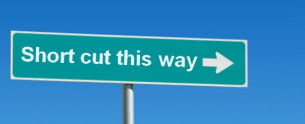 Green street sign reading, "Short cut this way"